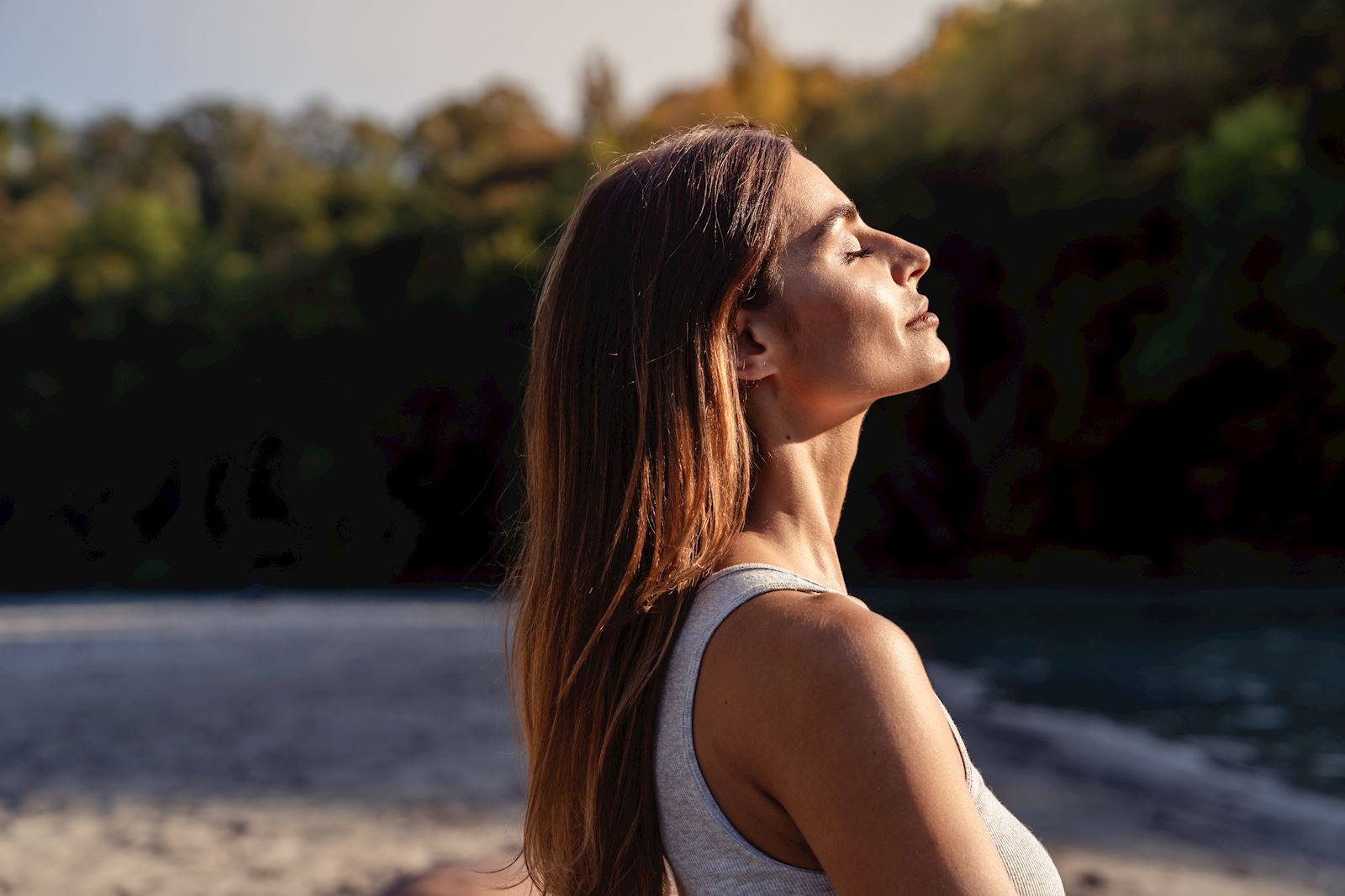 woman standing outside getting sunshine