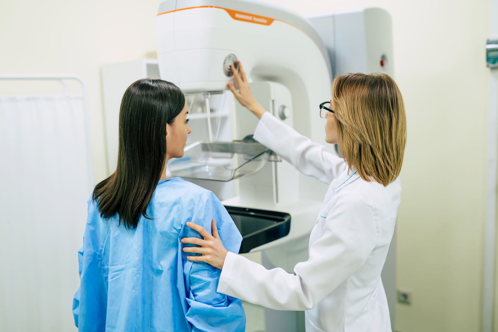 provider with woman getting mammogram