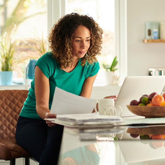 Women with laptop and documents