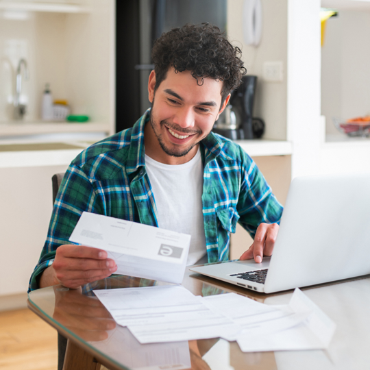 Man with documents and laptop