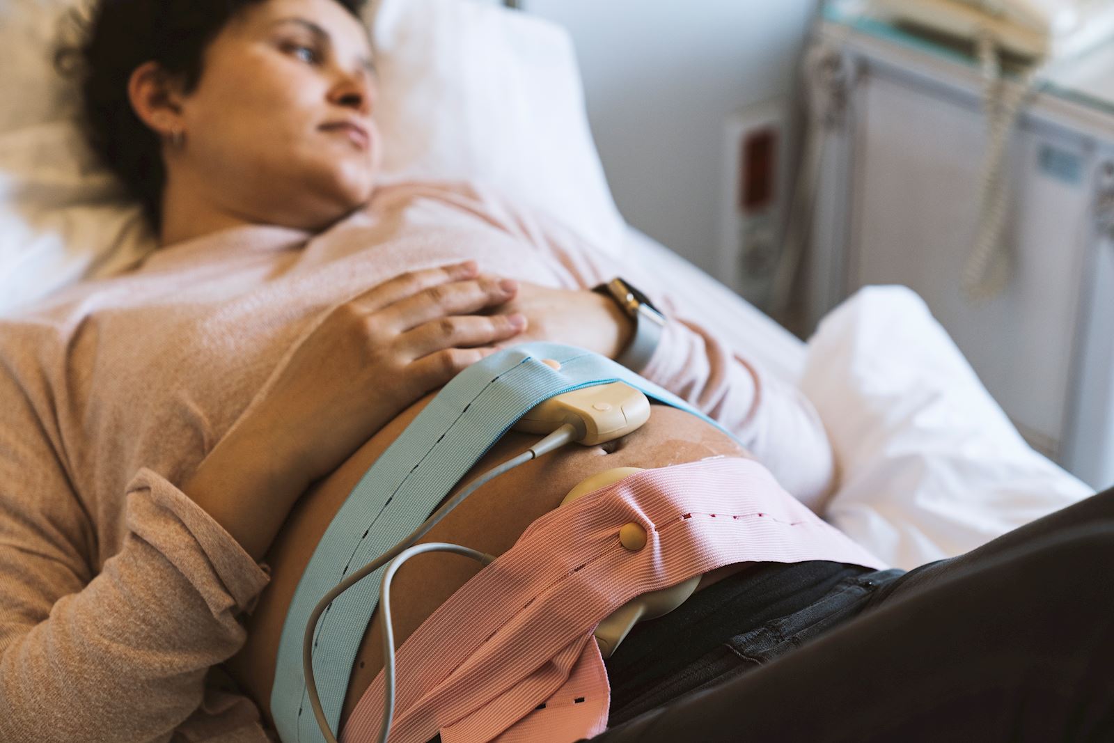pregnant woman with device on her stomach