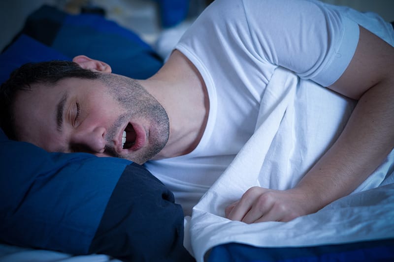 man sleeps with mouth open