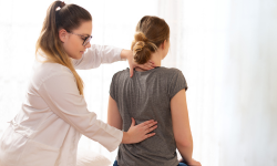 provider examining patients back